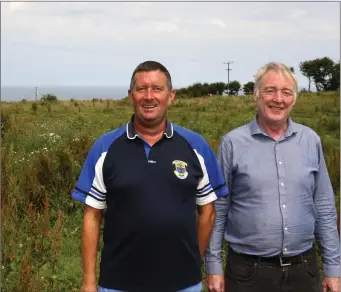  ??  ?? Chairman John Gill and Donal Marron on the 30 acre site purchased by St Patrick’s GAA Club.