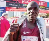  ?? —AFP ?? CHICAGO: Gideon Kipeter of Kenya finishes 3rd in the men’s race at the Bank of America Chicago Marathon yesterday in Chicago, Illinois.