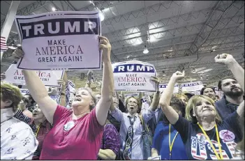  ??  ?? Supporters cheer Donald Trump as he speaks during a campaign rally held at the North Atlanta Trade Center on Saturday. He asked the crowd rhetorical­ly if he should take money from lobbyists; they responded with a resounding no.