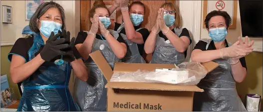  ??  ?? HUGE ROUND OF APPLAUSE: Staff at the Shedfield Lodge Care Home, near Southampto­n, take delivery of Mail Force masks. Pictured from left are Maria Ponteaux, 53, Megan Wills, 21, head of care Maria Willis, 32, Lisa Smith, 50, and deputy manager Nikki McCrudden, 43