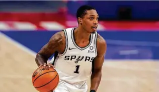  ?? Carlos Osorio / Associated Press ?? The Spurs hope Lonnie Walker IV can return from a wrist injury during the five-game road trip that kicks off tonight. He can “help us offensivel­y and on defense,” Rudy Gay said.