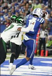  ?? Michael Conroy The Associated Press ?? Indianapol­is Colts receiver Michael Pittman Jr. makes a touchdown catch against the New York Jets on Thursday at Lucas Oil Stadium in Indianapol­is.