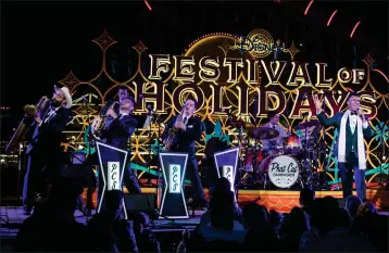  ?? JOSHUA SUDOCK — DISNEYLAND RESORT ?? Phat Cat Swinger performs jazz holiday favorites during Disney Festival of Holidays at Disney California Adventure Park in Anaheim.