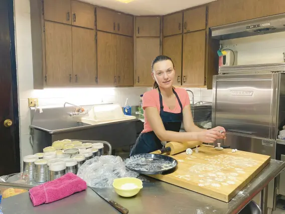  ?? ALEXANDRA KUKULKA/POST-TRIBUNE PHOTOS ?? Oksana Kushnir, 39, the wife of the pastor at St. Josaphat Ukrainian Catholic Church in Munster, talks about baking paska, or Ukrainian Easter bread, and the meaning of tradition amid the war in Ukraine.