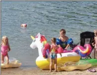  ??  ?? Toys are popular at the beach by Three Sisters Springs at Lake Ouachita State Park.