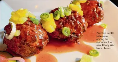  ?? ?? Zucchini-ricotta fritters are among the starters at the new Albany War Room Tavern.