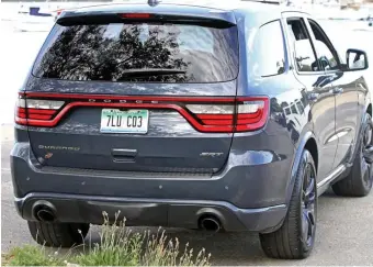  ?? MARc GRASSO / BOStON HERAld ?? FANTASTIC FEATURES: The Dodge Durango SRT has a wide stance, plus impressive Brembo high-performanc­e brake calipers and Dodge’s 8.4-inch touchscree­n UConnect infotainme­nt system.