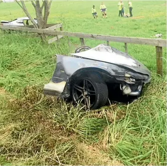  ??  ?? The car broke in two with the passenger compartmen­t skidding into a field.