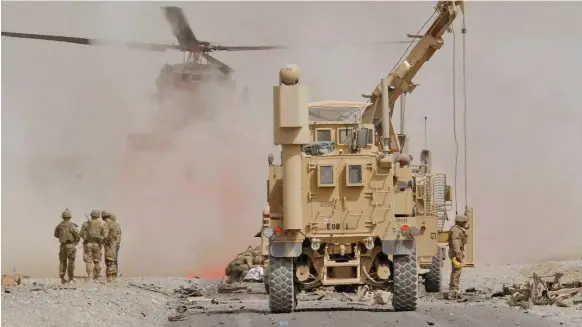  ?? Reuters ?? US troops assess damage after a suicide bomb attack in Kandahar recently. Mr Trump is frustrated by the stalemate in the 16-year war