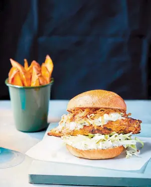  ??  ?? Tandoori burger with sweet potato wedges. Picture credit: PA Photo/John Carey