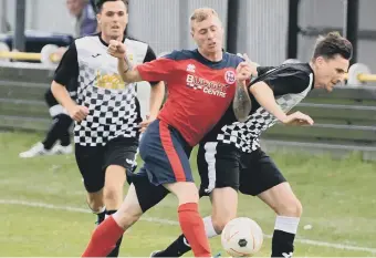  ??  ?? Boldon CA (black and white) scrap it out with Redcar Athletic on Saturday.