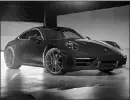  ?? COURTESY OF PORSCHE CARS NORTH AMERICA VIA AP ?? The 2021 Porsche 911 is available in Carrera 4 and Carrera 4S trims, both of which come with all-wheel drive.