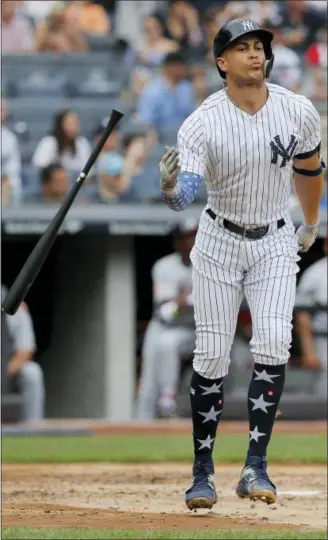  ?? JULIE JACOBSON — ASSOCIATED PRESS ?? Yankees’ Giancarlo Stanton tosses his bat after connecting for a three-run homer in the third inning of Wednesday’s game at Yankee Stadium in New York.