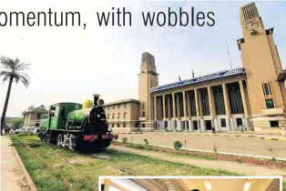  ?? PHOTOS: REUTERS ?? Past and present . . . Baghdad’s historic central railway station; (inset) a policeman stands guard in a carriage on the way from Baghdad to Fallujah.