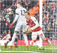  ??  ?? Arsenal defender Nacho Monreal (right) celebrates after scoring against Crystal Palace during yesterday’s English Premier League match at the Emirates Stadium. – AFPPIX
