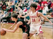  ?? PILOT PHOTO/SUE GARRITY ?? Plymouth’s Davis Wray protects the lane against Warsaw.