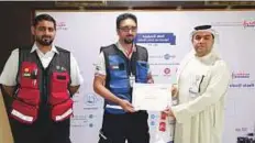  ?? Courtesy: Dubai Corporatio­n for Ambulance Services ?? Talib Ghuloom, Director of Operations Department, along with Khalid Qasim Beloushi, Head of Emergency Dispatch, honour Essam Al Faqih with a certificat­e of appreciati­on.