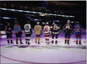  ?? LYNNE SLADKY — THE ASSOCIATED PRESS ?? NHL hockey players stand before they are introduced before the NHL All Star Skills Showcase on Friday in Sunrise, Fla.