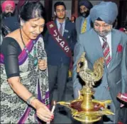  ??  ?? Chief Guest Justice GS Sistani lightning the ceremonial lamp.