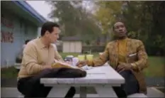  ?? UNIVERSAL PICTURES ?? Tony, portrayed by Viggo Mortensen, left, gets advice on how to write romantic letters to his wife from Don, portrayed by Mahershala Ali, in “Green Book.”