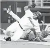  ?? LYNNE SLADKY/AP ?? The Marlins’ Jesús Aguilar collides with the Phillies’ Bryson Stott as he is thrown out at second during the first inning Friday. Aguilar drove in a run on the play.