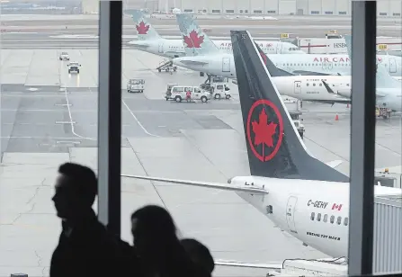  ?? STEVE RUSSELL TORONTO STAR ?? Air Canada Flight 758 sits in Toronto on Wednesday. A Boeing 737 Max 8, it arrived from San Francisco and is one of the last to land in Canada.