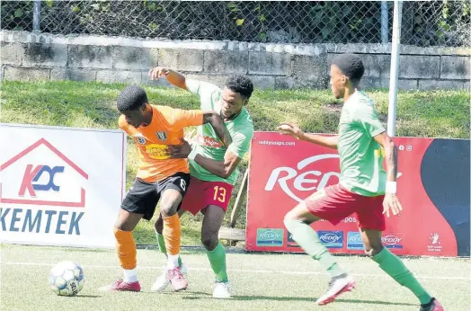  ?? KENYON HEMANS ?? Tivoli Gardens’ Horatio Morgan (left) is tackled by Humble Lions’ Mark Rodney during Jamaica Premier League action at the UWI-JFF Captain Horace Burrell Centre of Excellence last Saturday.