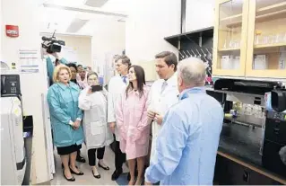  ?? OCTAVIO JONES/AP ?? Dr. Shamarial Roberson, from left, state Sen. Janet Cruz, Dr. Scott Rivkees, Lt. Gov. Jeanette Nunez and Gov. Ron DeSantis listen as Andrew Cannons explains the testing procedures of potential coronaviru­s cases.