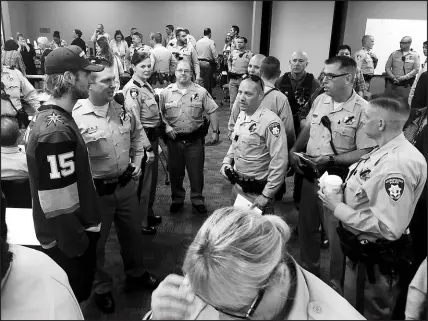  ?? SUN FILE (2017) PHOTOS ?? Jon Merrill (15) and several Vegas Golden Knights teammates visit Metro Police headquarte­rs Oct. 3, 2017, two days after the Route 91 shooting, to offer their support. Merrill, Jason Garrison, William Karlsson, Griffin Reinhardt, Erik Haula, Deryk Engelland and others made three stops that day to help support first responders, starting at Metro headquarte­rs.
