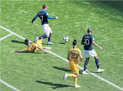  ?? HASSAN AMMAR/THE ASSOCIATED PRESS ?? After a video review, France was awarded a penalty for this tackle of forward Antoine Griezmann by Australia’s Joshua Risdon.