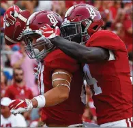 ?? AP/BUTCH DILL ?? Alabama wide receiver Derek Kief (81) celebrates with wide receiver Tyrell Shavers (14) on Saturday after scoring a touchdown during the third quarter of the Crimson Tide’s victory. The 14-yard touchdown reception was Kief’s only catch of the game.