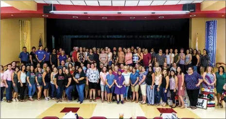  ?? VINCENT OSUNA PHOTO ?? Over 100 Imperial Unified School District teachers in attendance pose on stage for a group picture during the ninth annual Welcome Back Teachers Luncheon event hosted by the Imperial Chamber of Commerce on Tuesday afternoon at Frank Wright Middle School in Imperial.