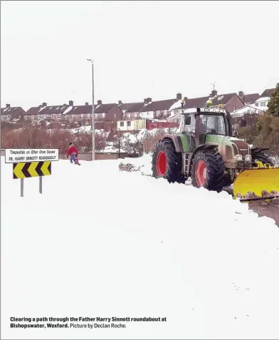  ??  ?? Clearing a path through the Father Harry Sinnott roundabout at Bishopswat­er, Wexford.