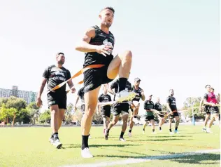  ?? PHOTO: GETTY IMAGES ?? Stepping up . . . Prop Sam Burgess puts the effort in at a Rabbitohs training session at Redfern Oval in Sydney yesterday.