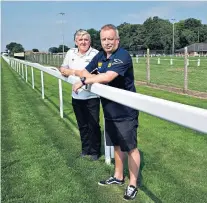  ??  ?? Grand setting: Royal Ascot Cricket Club has a spectacula­r backdrop (above), shared also by Ascot United’s director of football Neil Richards (near left) and director Doug Page