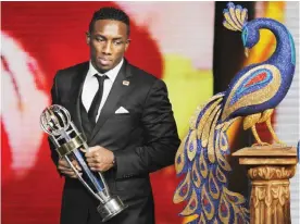  ??  ?? NEW DELHI: United Arab Emirate’s Ahmed Khalil, stands after receiving the player of the year award during the Asian Football Confederat­ion (AFC) annual awards in New Delhi, India, yesterday. —AP