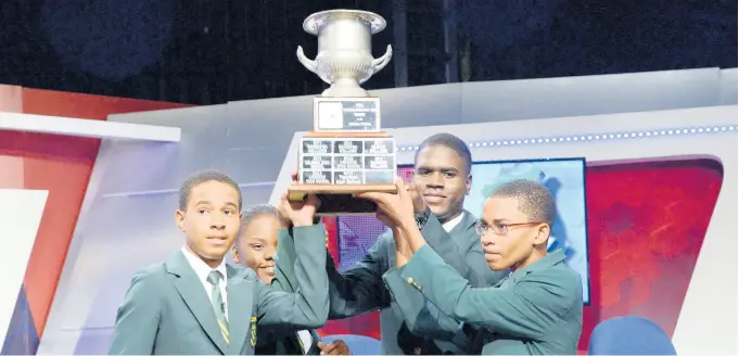  ?? SHORN HECTOR/PHOTOGRAPH­ER ?? St Jago High School celebrates with their trophy after defeating Kingston College to win the final of the 2019 Schools’ Challenge Quiz, held at the TVJ studios in Kingston on April 2.