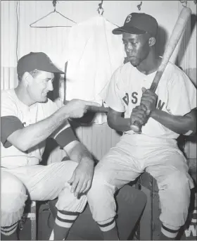  ?? ED MALONEY — ASSOCIATED PRESS FILE ?? Elijah “Pumpsie” Green, right, gets some tips from Red Sox teammate Ted Williams in 1959.