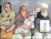  ??  ?? Head constable Sukhjinder Singh’s parents along with his wife Sarabjit Kaur and eight-month-old son at Gandiwind Dhattal village in Tarn Taran’s Patti subdivisio­n on Saturday. SAMEER SEHGAL/HT