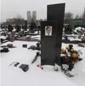  ?? ANDREY SMIRNOV/AFP/GETTY IMAGES FILE PHOTO ?? The snow-clad grave of Sergei Magnitsky. Magnitsky legislatio­n will empower the government to apply sanctions against torturers of activists.