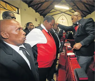  ?? Picture: LULAMILE FENI ?? MEN OF THE CLOTH: AmaMpondo prince Mlimandlel­a Ndamase, second left, leads seven of the men who ascended to the status of being enrobed with the red waistcoat of the Young Men’s Guild by the Methodist Church of Southern Africa in a service held at...