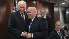  ?? AP PHOTO/J. SCOTT APPLEWHITE ?? House Ways and Means Committee Chairman Kevin Brady, R-Texas (center), embraces Senate Finance Committee Chairman Orrin Hatch, R-Utah (left), as House and Senate conferees after GOP leaders announced they have forged an agreement on a sweeping overhaul...