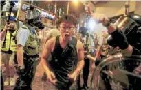  ?? Photo / AP ?? Police used tear gas to break up a protest outside a police station in Hong Kong’s blue-collar Sham Shui Po neighbourh­ood.