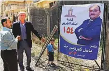  ?? AFP ?? Campaign poster of Basil Gorgis, a former Iraqi footballer, in Arbil. Gorgis is running in the Kurdish city and says he seeks to protect the interests of Christians.