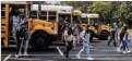  ?? AJC FILE ?? Area school districts are scrambling to hire more bus drivers and adjusting schedules in the meantime.