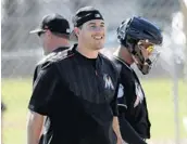  ?? DAVID J. PHILLIP/ASSOCIATED PRESS ?? J.T. Realmuto’s athleticis­m and versatilit­y help him make the transition from catcher to occasional first baseman.