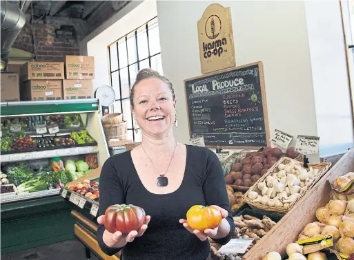  ?? ANDREW FRANCIS WALLACE/TORONTO STAR ?? As the manager of a longtime neighbourh­ood fixture, Karma Co-op’s Talia McGuire has a reputation for greeting every store customer and co-op member by name.