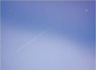  ??  ?? Believe it or not, Michael Boschat snapped this dazzling photo of a meteor from inside his Halifax home. It was taken during last year’s Geminid meteor shower.