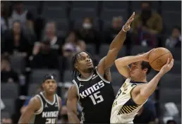  ?? JOSE LUIS VILLEGAS — THE ASSOCIATED PRESS ?? Sacramento Kings guard Davion Mitchell (15) defends against Indiana Pacers guard T.J. McConnell (9) during the first half of an NBA basketball game in Sacramento Sunday.