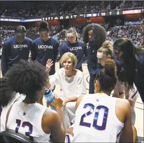  ?? Jessica Hill / Associated Press ?? UConn associate head coach Chris Dailey talks to her players during a timeout in the first half Sunday in Uncasville.